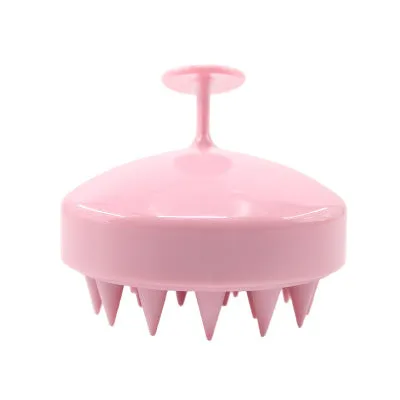 Silicone scalp massage brush with soft bristles in green colour on white background