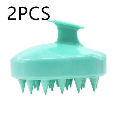 Silicone scalp massage brush with soft bristles in green colour on white background