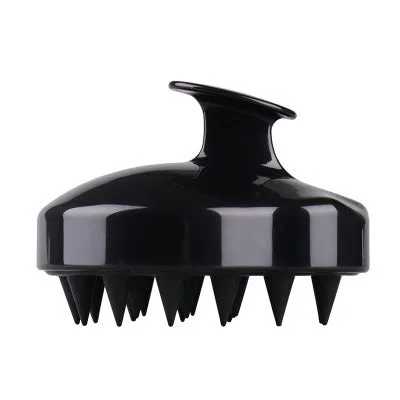 Silicone scalp massage brush with soft bristles in green colour on white background