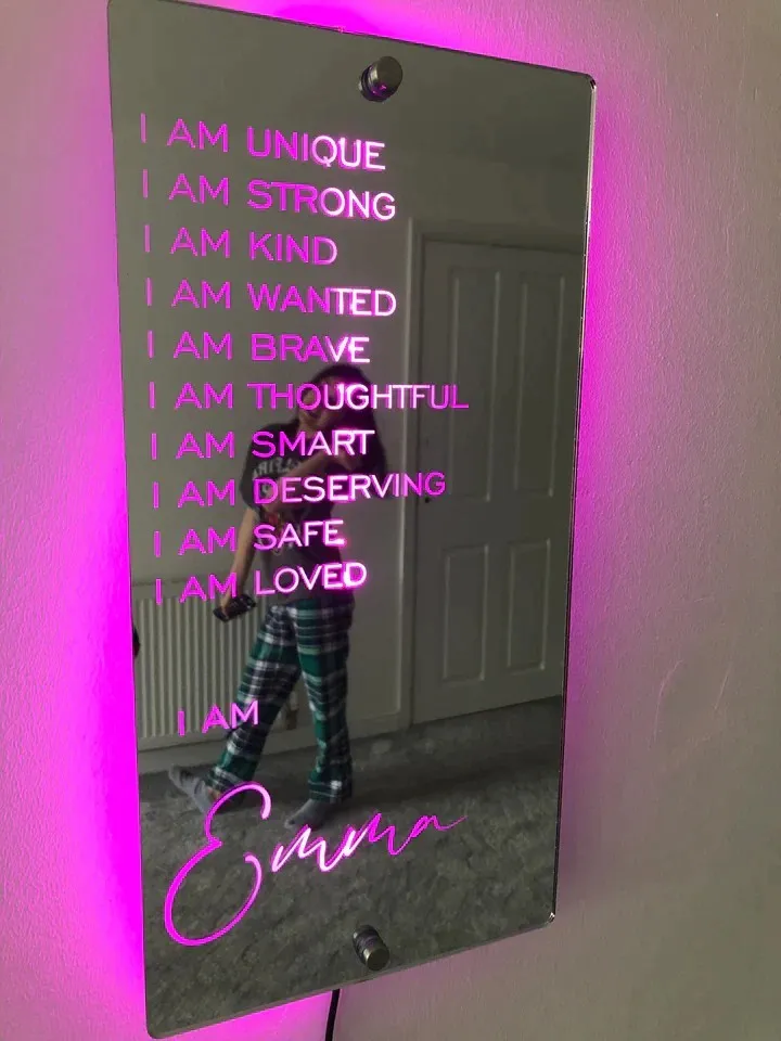Personalised acrylic name mirror light with LED glow on wall in picture colour