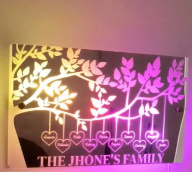 Personalised acrylic name mirror light with LED glow on wall in picture colour