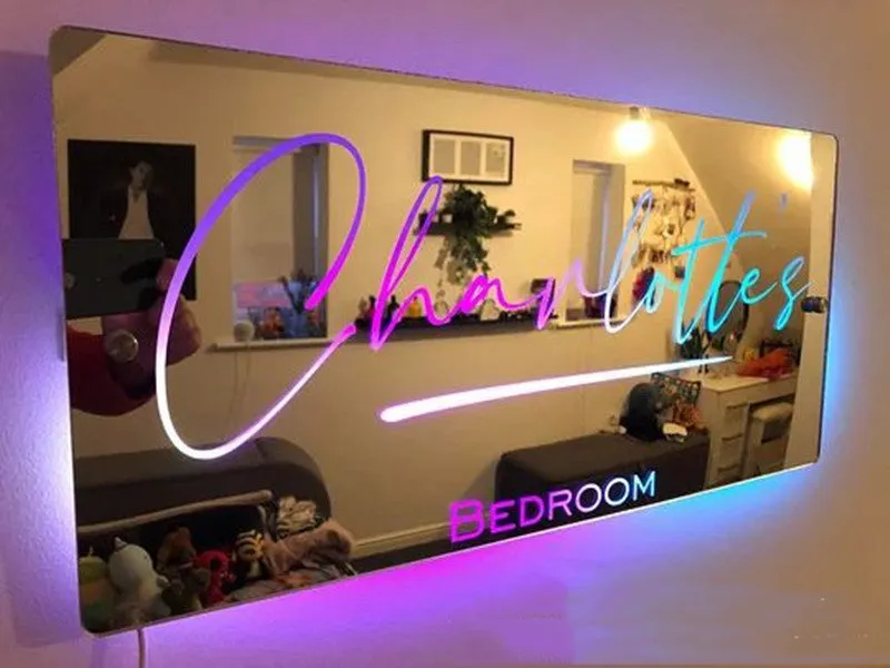 Personalised acrylic name mirror light with LED glow on wall in picture colour