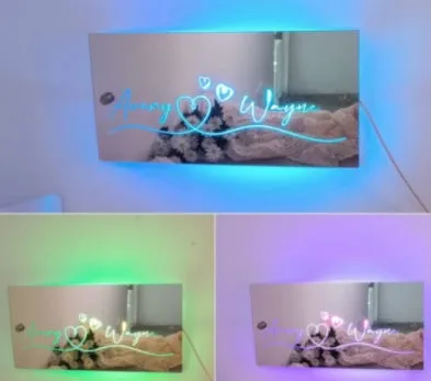 Personalised acrylic name mirror light with LED glow on wall in picture colour