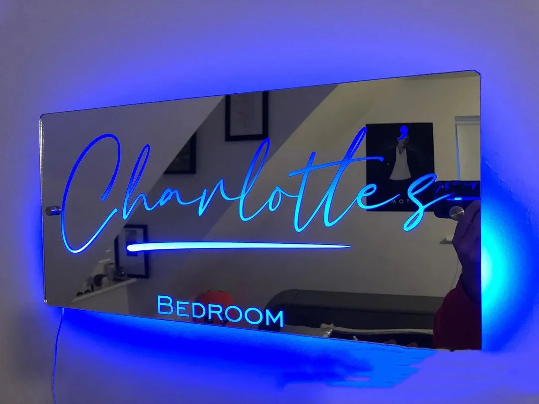 Personalised acrylic name mirror light with LED glow on wall in picture colour
