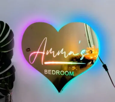 Personalised acrylic name mirror light with LED glow on wall in picture colour