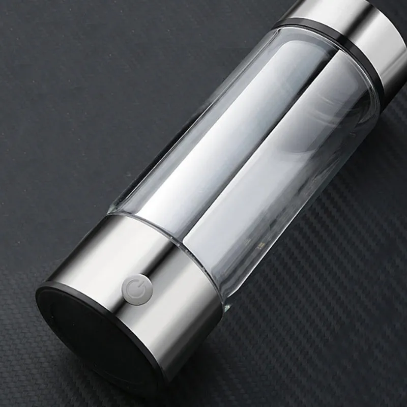 Portable hydrogen water cup with high borosilicate glass body and 304 stainless steel components, showing electrolysis bubbles.