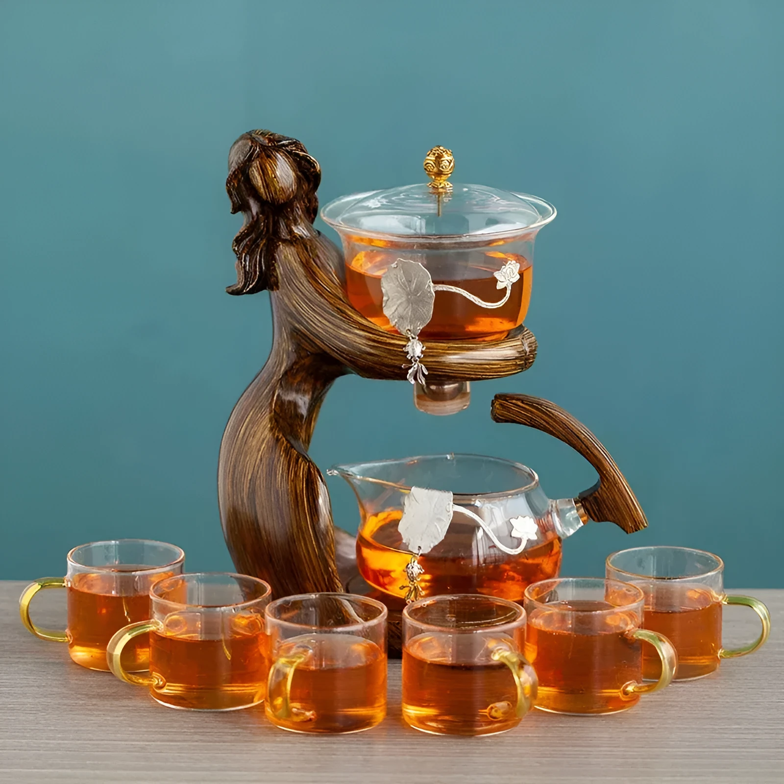 Maid semi-automatic glass tea set with heat-resistant borosilicate glass teapot, stainless steel filters, and Chinese style frame on a tea tray