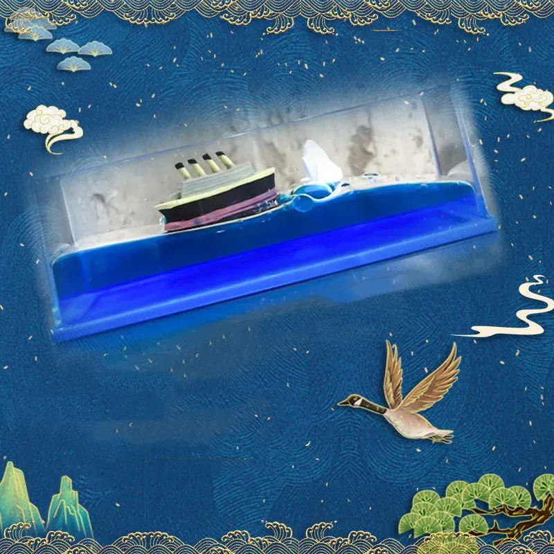 Fluid drift bottle with floating astronaut decoration in acrylic resin, black pearl pirate ship style, on a wooden desk.