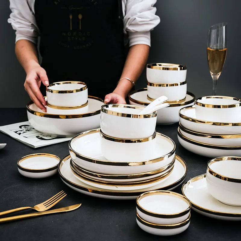 Porcelain bowls and plates with gold trim, American style, 4.5 inch bowl and 8 inch dish on table