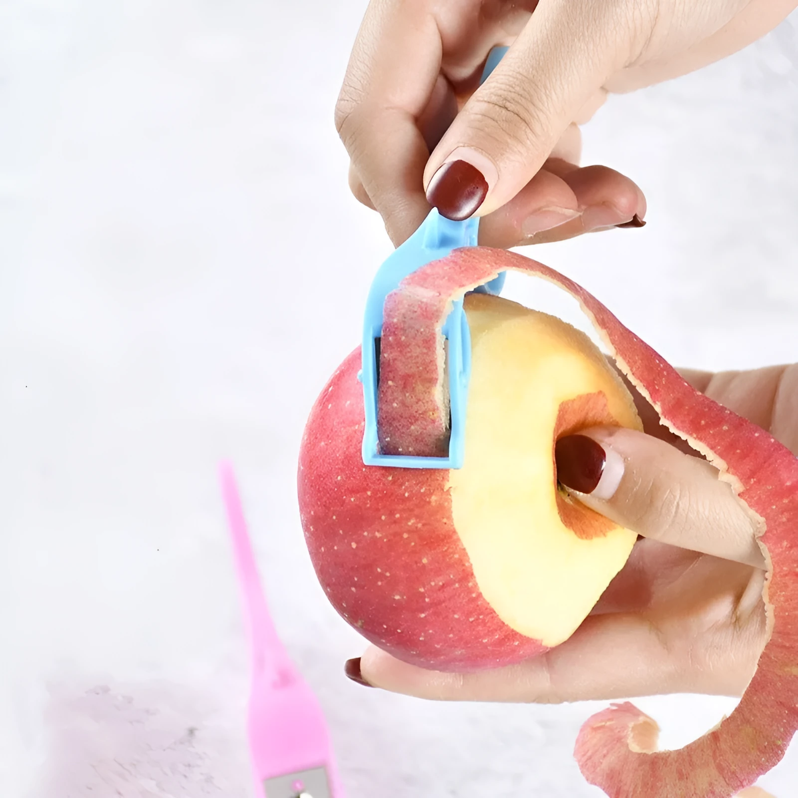 Blue multifunctional fruit peeler with stainless steel blade and finger ring continuous scraping design