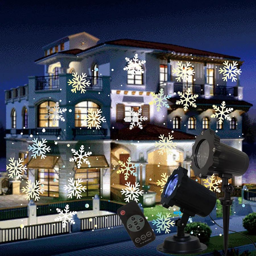 LED Christmas snowflake laser light projector IP65 waterproof with white snowflakes projecting onto a garden wall at night