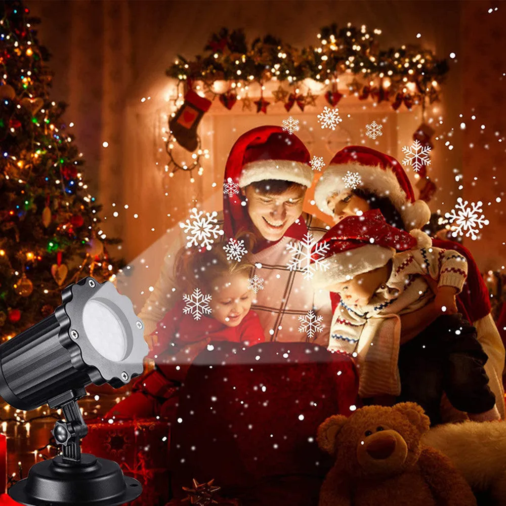 LED Christmas snowflake laser light projector IP65 waterproof with white snowflakes projecting onto a garden wall at night