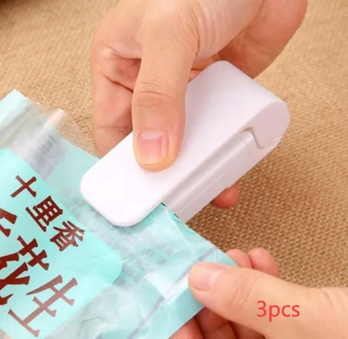 Pink household food clip portable mini plastic bag heat sealer on white background