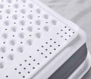 Folding off-white Japanese style dish drainer rack with porous drainage for drying tableware and vegetables