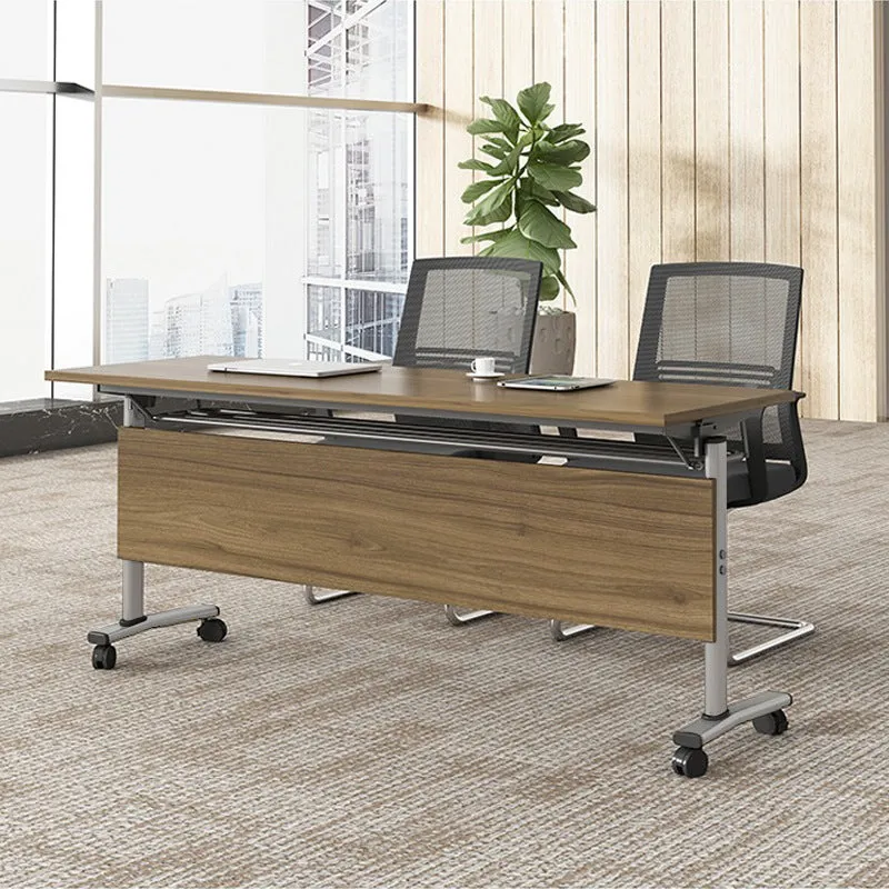 Black leather office chair with metal frame, armrests, and swivel base on a wooden floor