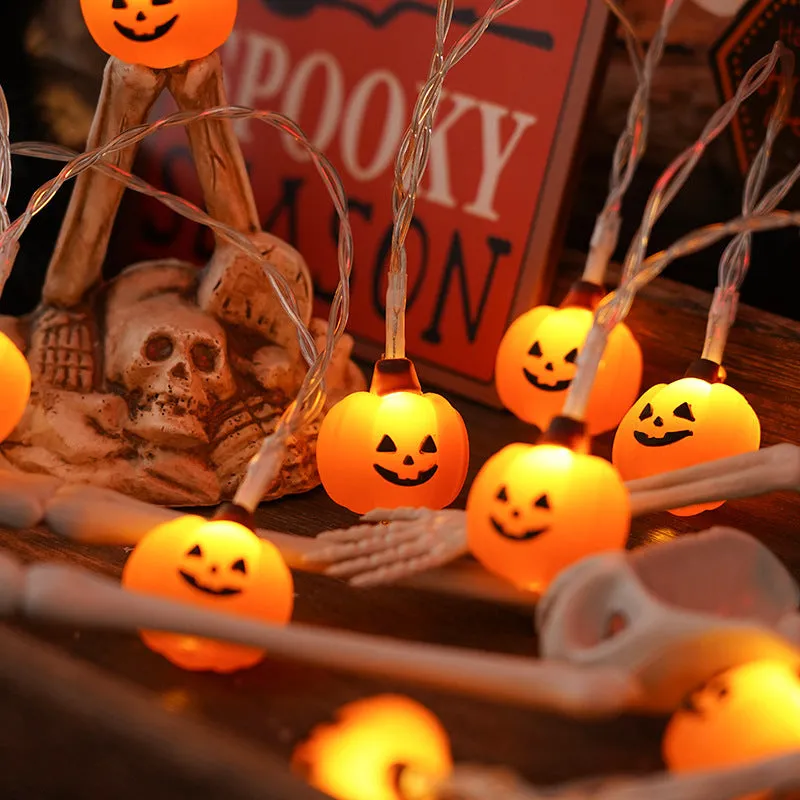 PVC Halloween lighting chain with pumpkin, ghost and bat shapes in warm white LED glow