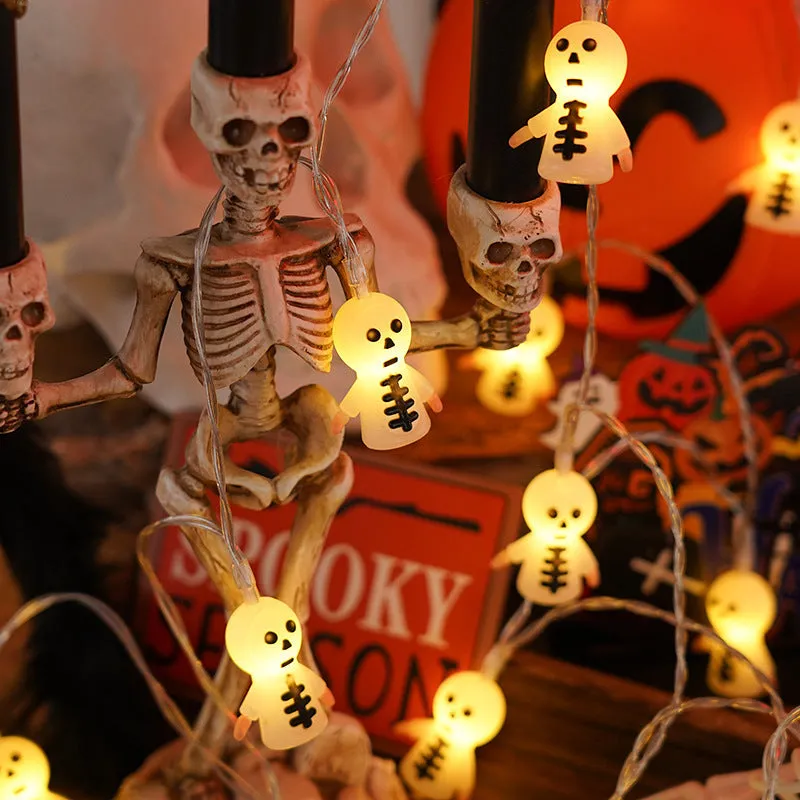 PVC Halloween lighting chain with pumpkin, ghost and bat shapes in warm white LED glow