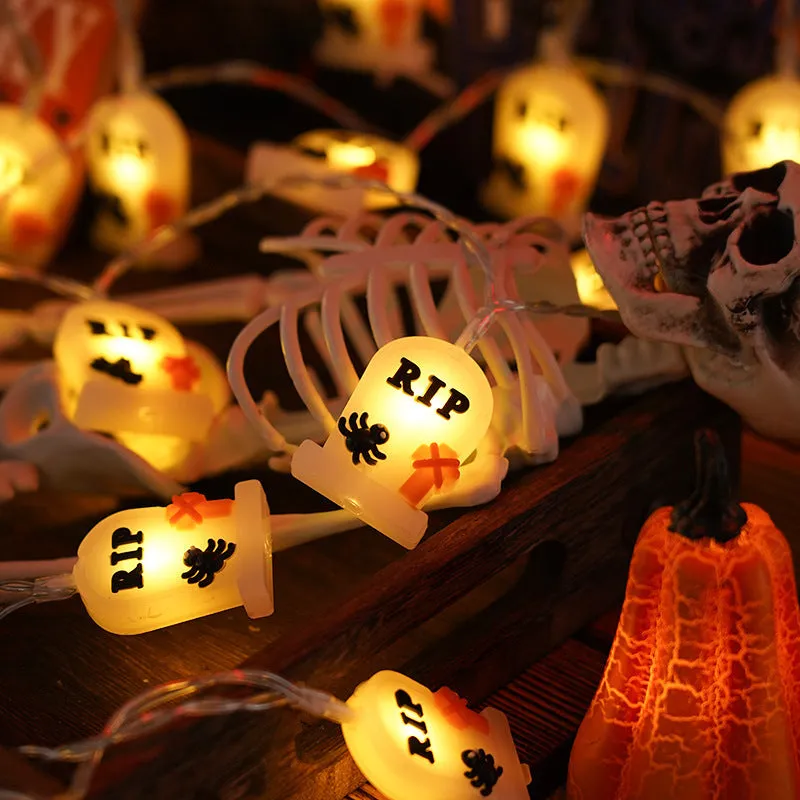 PVC Halloween lighting chain with pumpkin, ghost and bat shapes in warm white LED glow