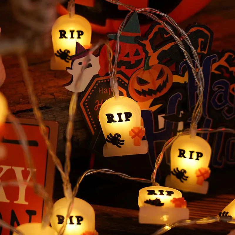 PVC Halloween lighting chain with pumpkin, ghost and bat shapes in warm white LED glow