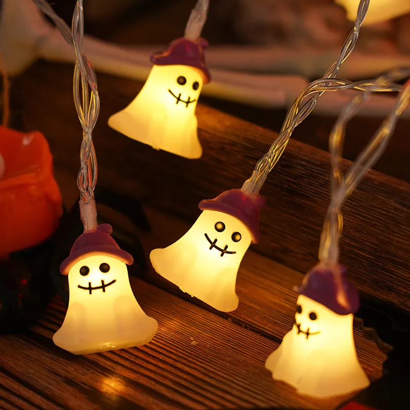 PVC Halloween lighting chain with pumpkin, ghost and bat shapes in warm white LED glow
