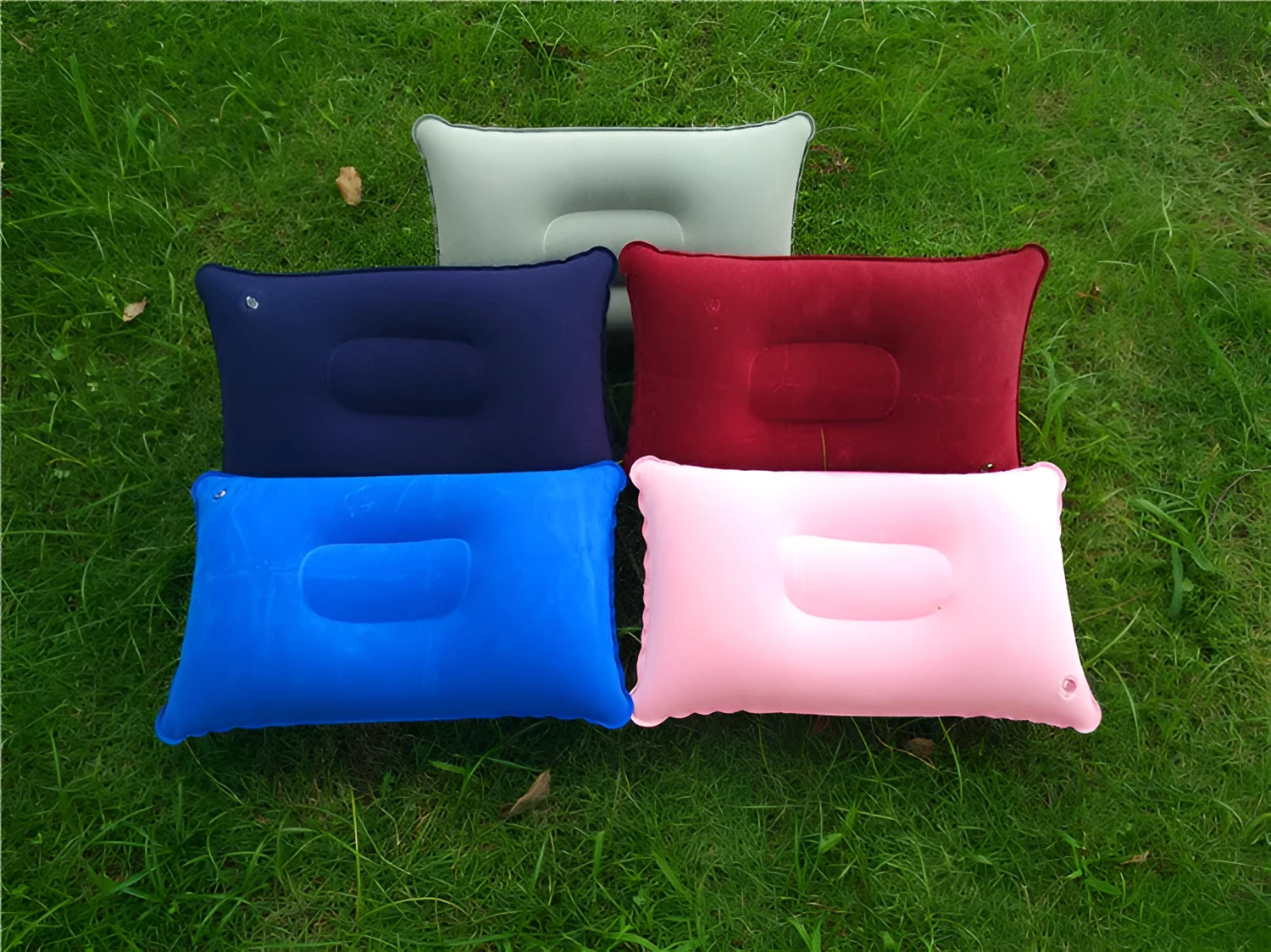 Rectangular PVC flocking inflatable camping pillow 38x24cm in grey on outdoor ground