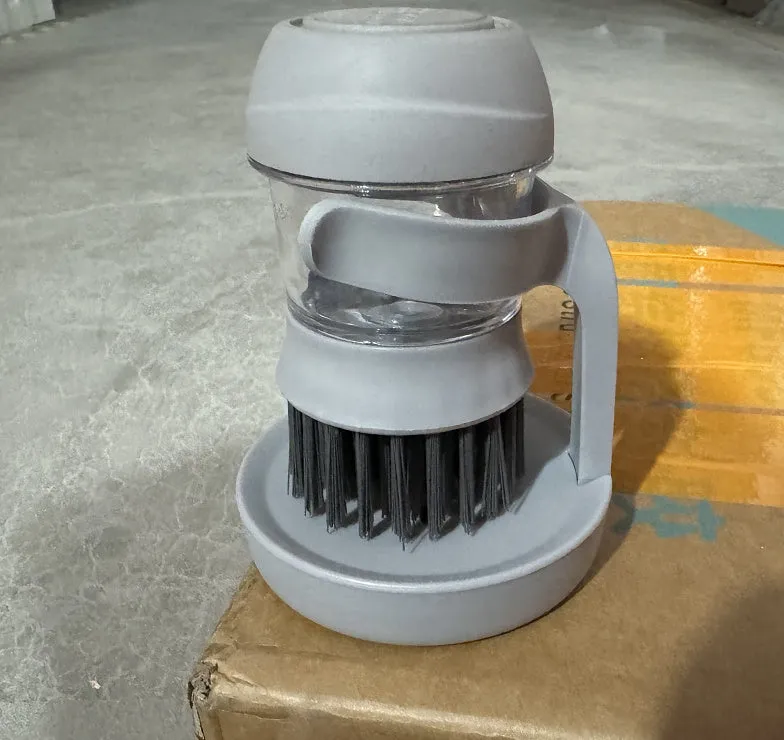 Automatic liquid adding cleaning brush in grey, with scraper edge and compact hand-held design