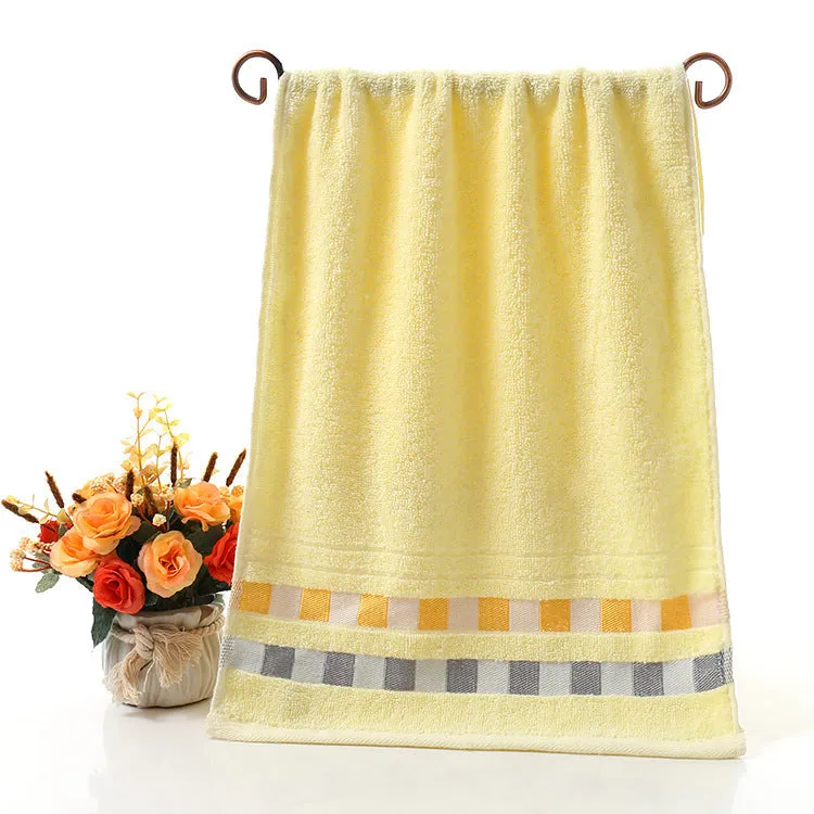 Cotton face towel 73x33cm in blue pink yellow patterns on hanger