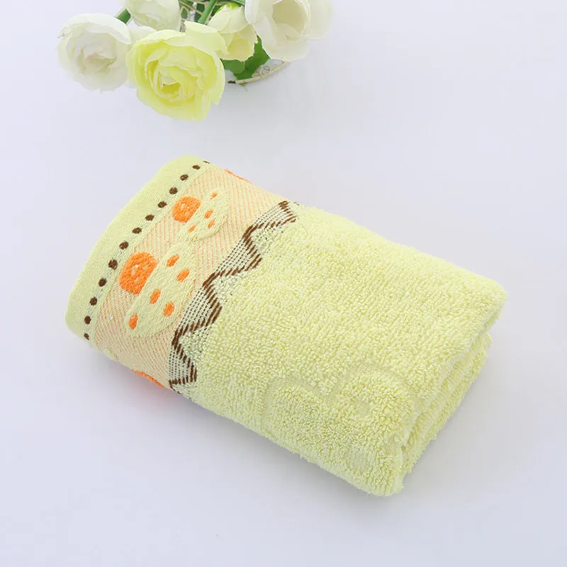 Cotton face towel 73x33cm in blue pink yellow patterns on hanger