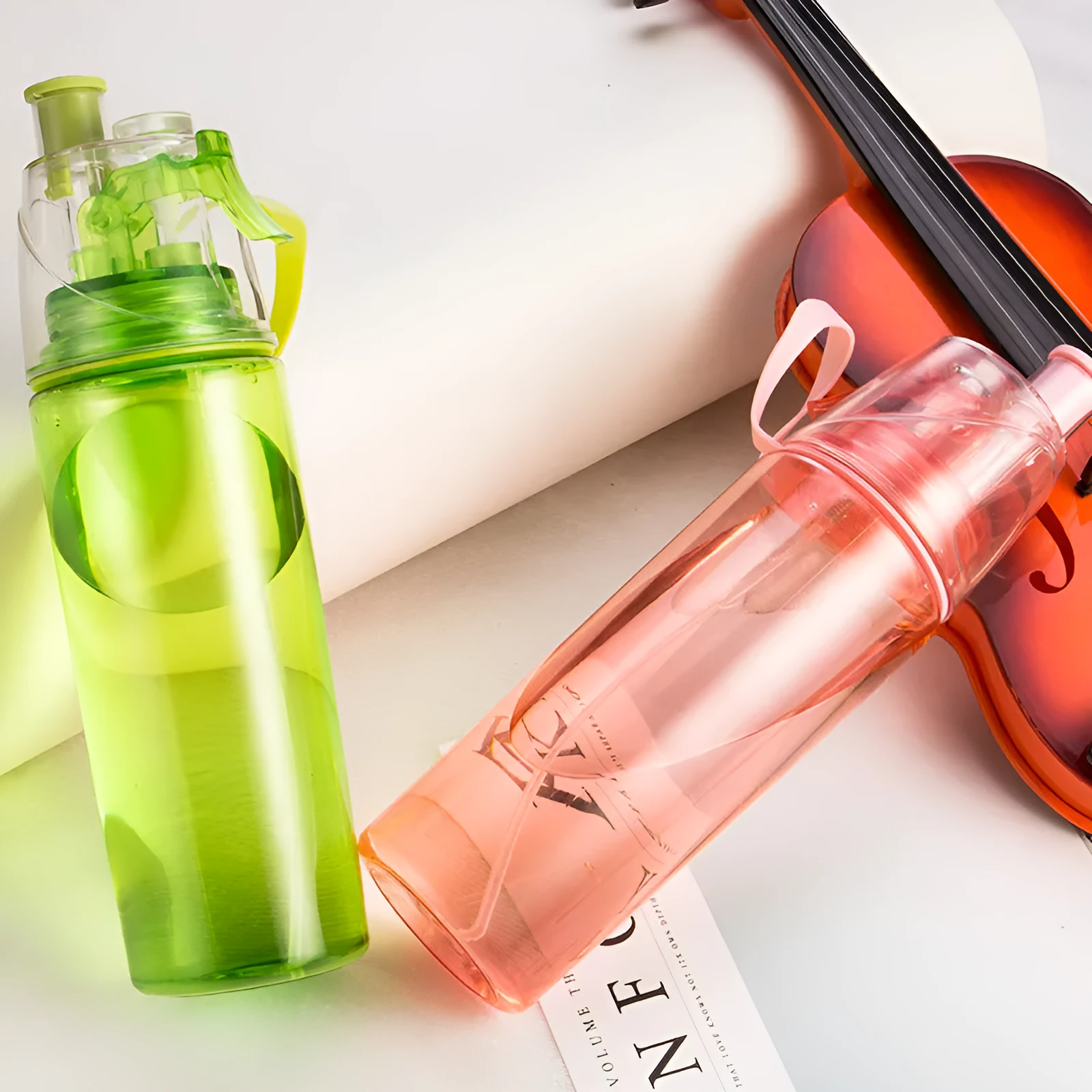 600ml sports cycling mist spray water bottle in pink with spray button, heat resistant and waterproof design