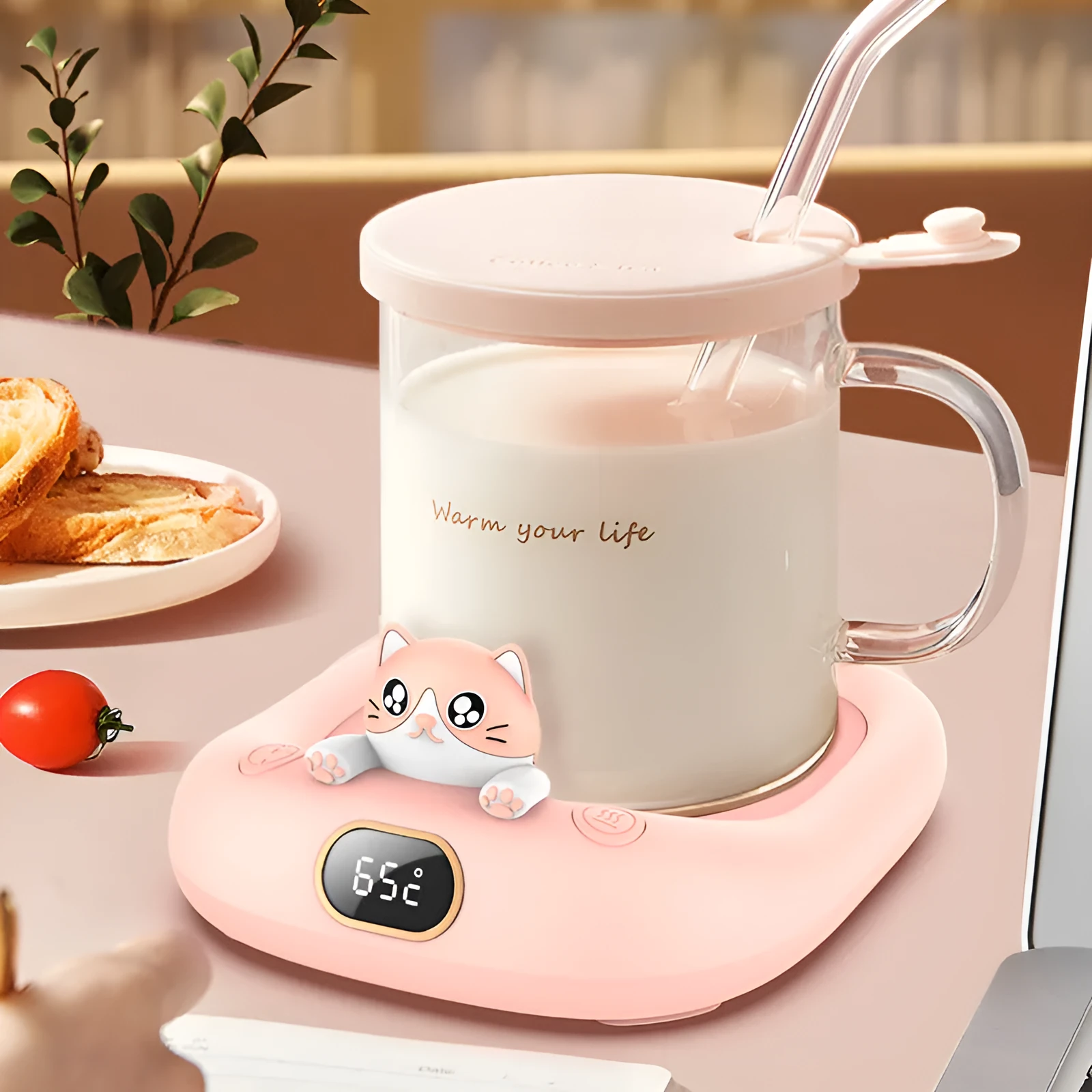 Pet cup warming holder in pink ABS and electroplated metal with a cup sitting on top