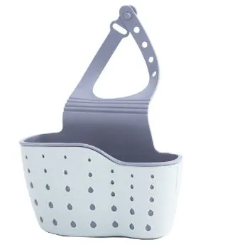 Set of three plastic kitchen sink storage racks in light blue, light pink, and beige on a countertop