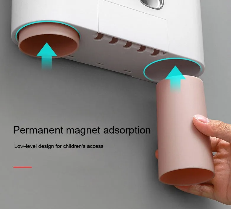 Plastic wall-mounted toothbrush holder with four magnetic cups in pink, blue, and green for family bathroom