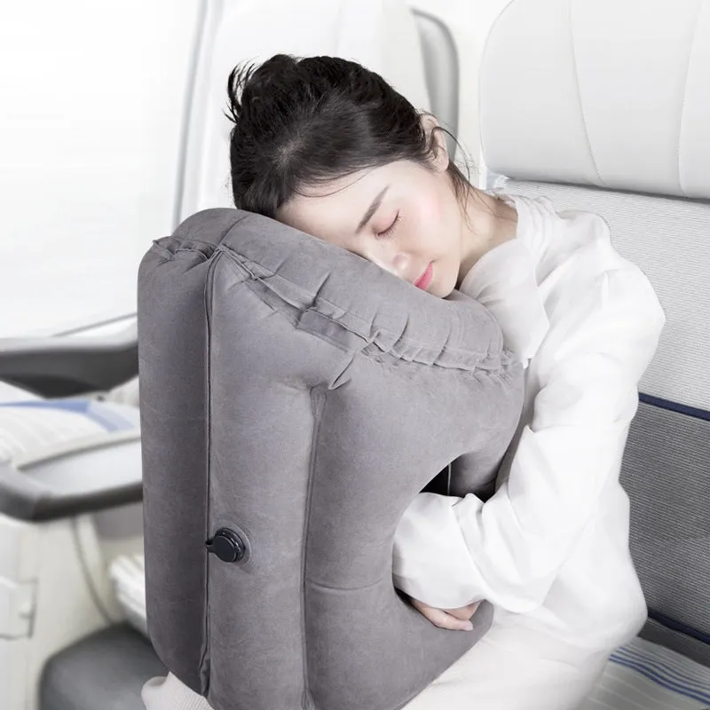 Grey inflatable travel pillow with flocking surface, M size 26cm x 31cm x 51cm, shown inflated with storage bag