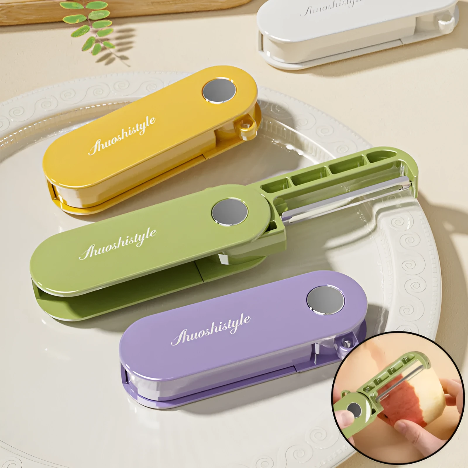 Foldable stainless steel vegetable peeler on white background, compact 91x36x18mm kitchen tool