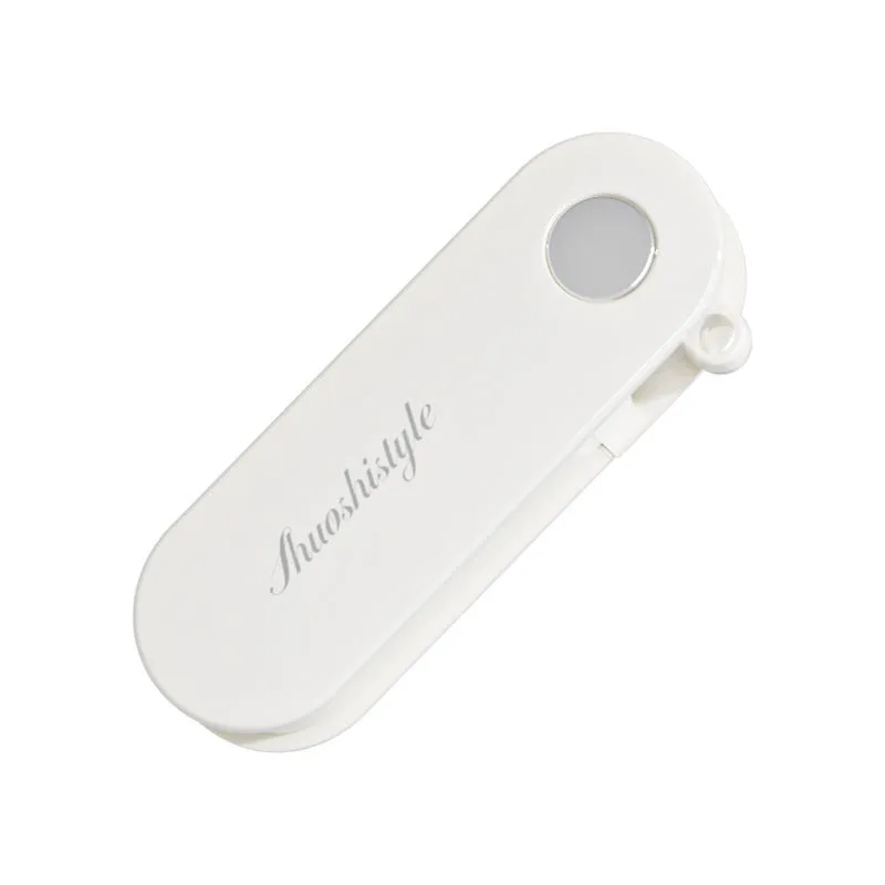 Foldable stainless steel vegetable peeler on white background, compact 91x36x18mm kitchen tool