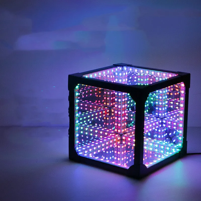 Thousand Mirrors 3D magic cube RGB LED lamp in black finish with remote control on desk