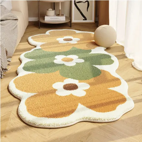 Flower-shaped blanket with printed cartoon floral design in green and white colours, laid flat.