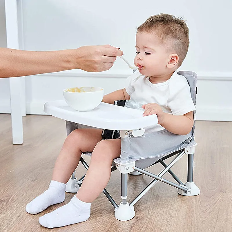 Foldable baby dining chair with metal frame, removable tray, and safety belt in grey