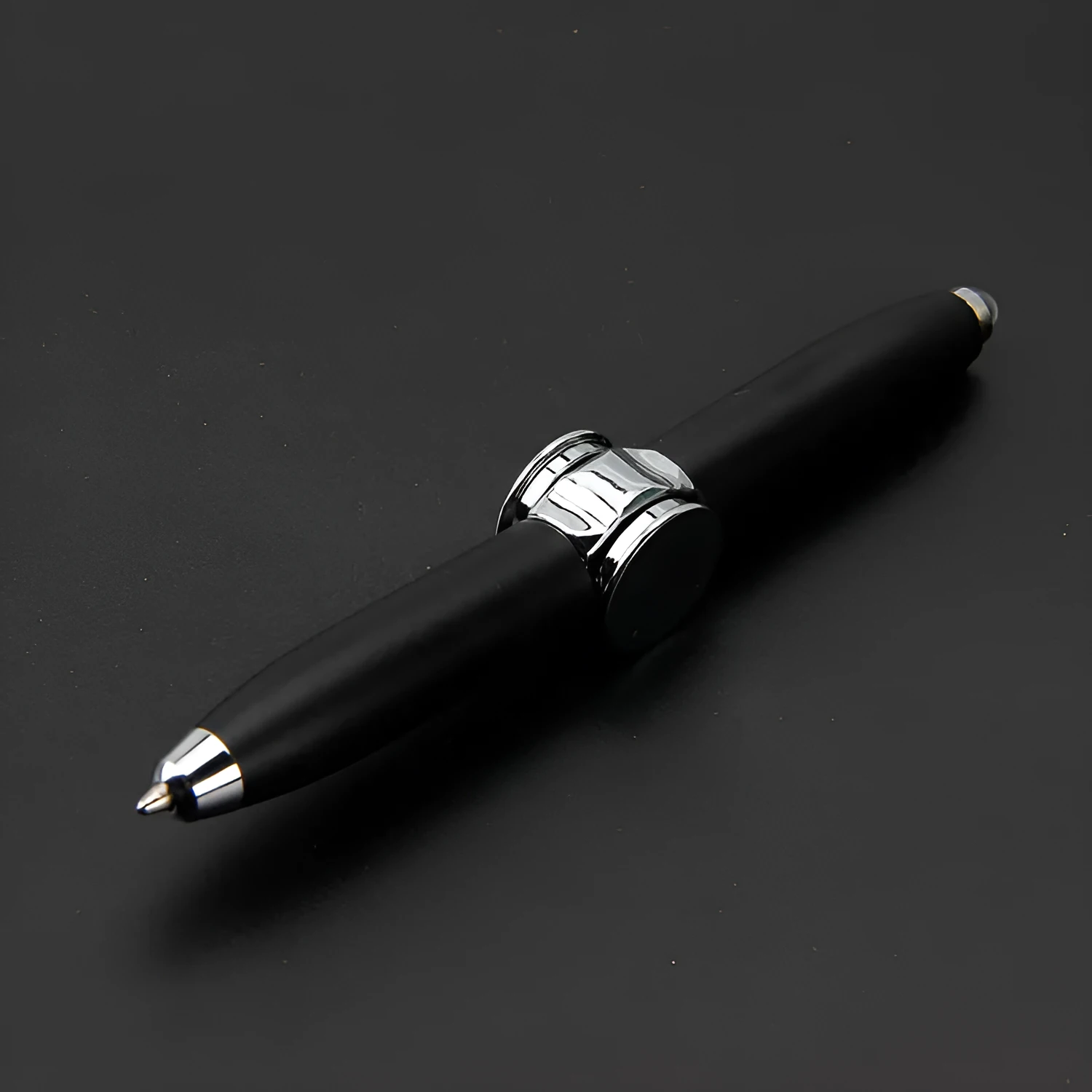 Multifunctional finger gyro ballpoint pen set in black, gold, and silver colours on a white background