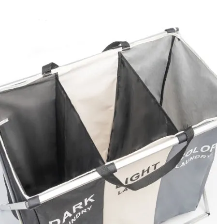 Foldable three-compartment laundry basket in Oxford cloth with aluminium frame, collapsed for space-saving storage