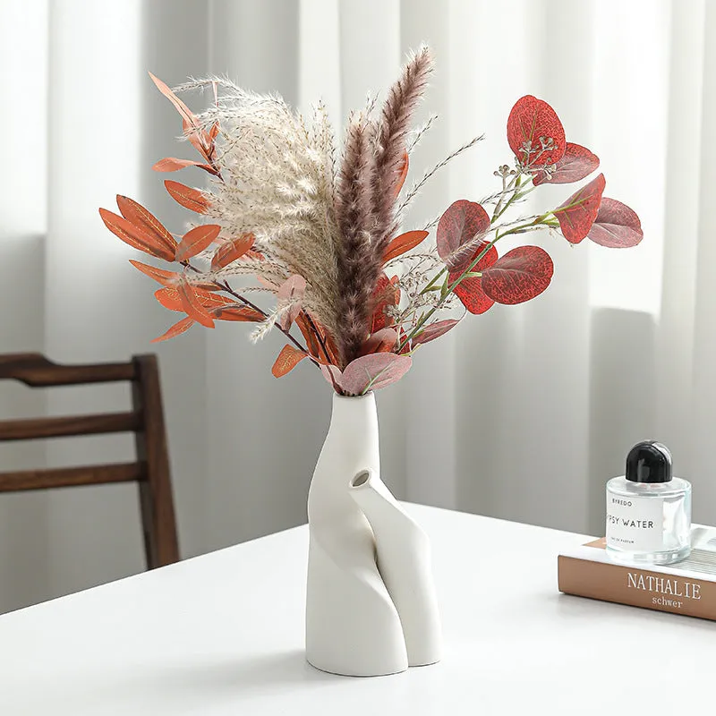 Ceramic shaped double vase in cream colour for Nordic home decoration on shelf