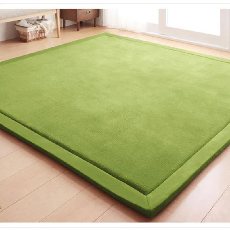 Thick coral velvet non-slip tatami mat in olive green, hand woven finish, placed on wooden floor