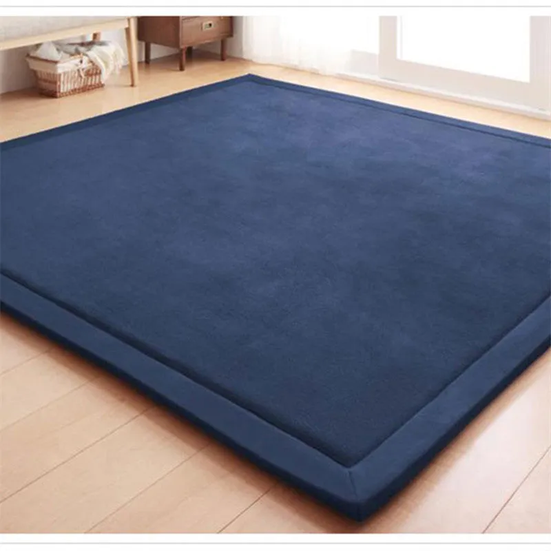 Thick coral velvet non-slip tatami mat in olive green, hand woven finish, placed on wooden floor