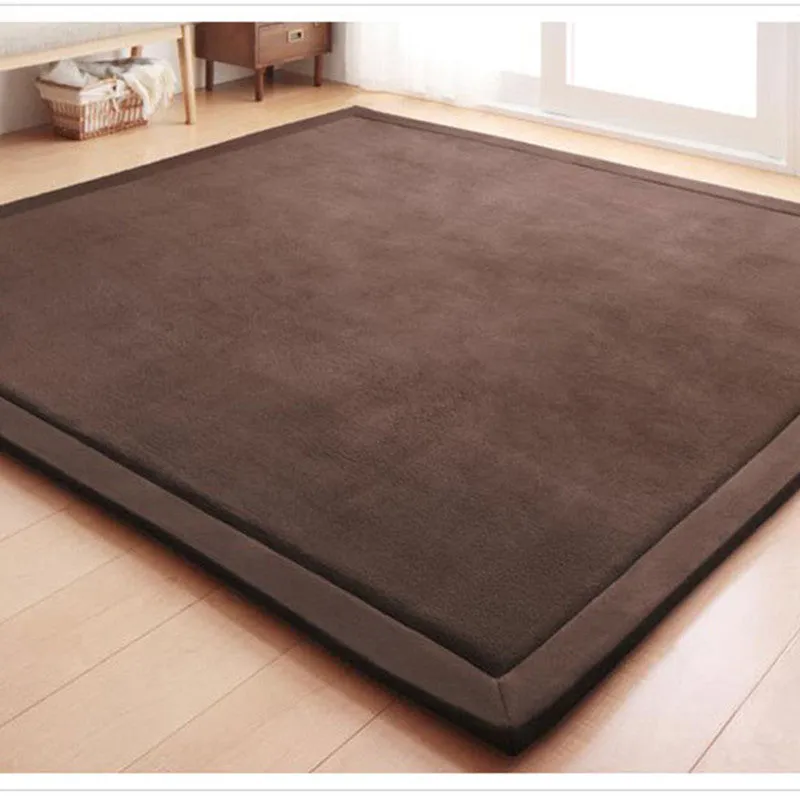 Thick coral velvet non-slip tatami mat in olive green, hand woven finish, placed on wooden floor