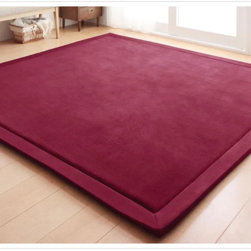 Thick coral velvet non-slip tatami mat in olive green, hand woven finish, placed on wooden floor