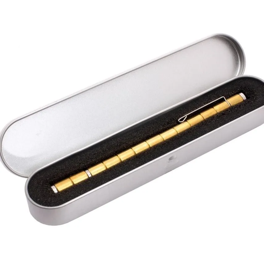 Magnetic modular fidget pen with silver finish, magnetic rings, steel balls, and capacitive head on a table