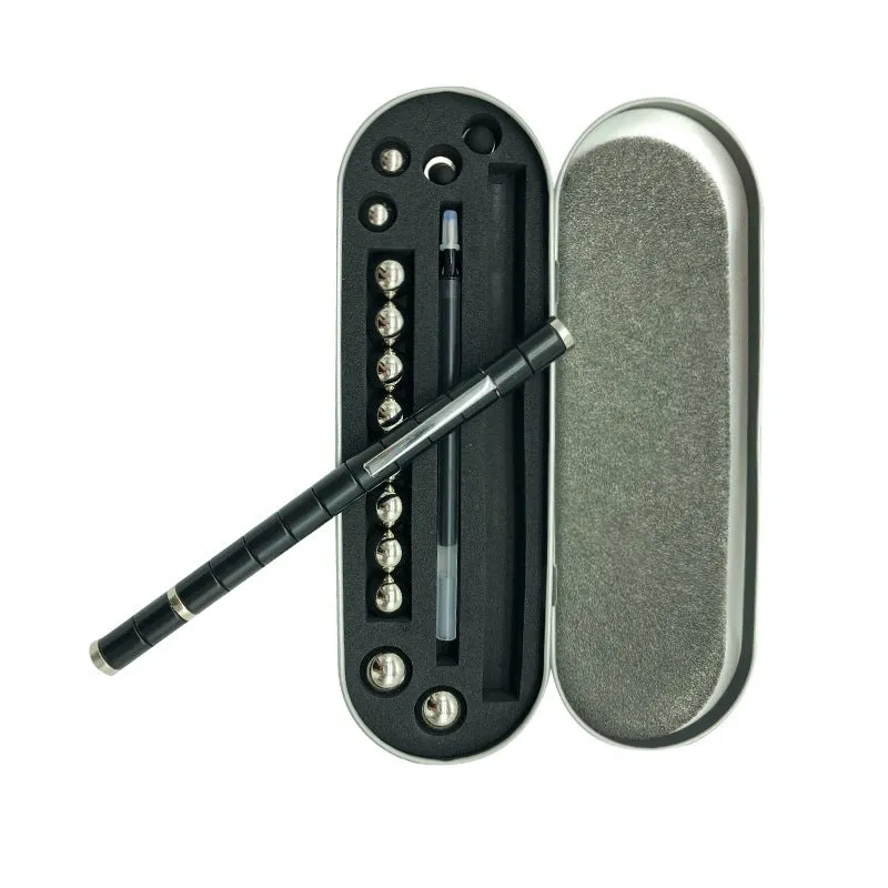 Magnetic modular fidget pen with silver finish, magnetic rings, steel balls, and capacitive head on a table