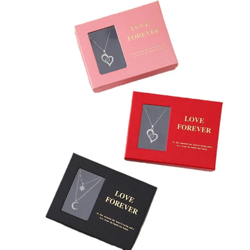 Red Korean-style gift box open to show six pink soap flowers, with a matching handbag beside it.