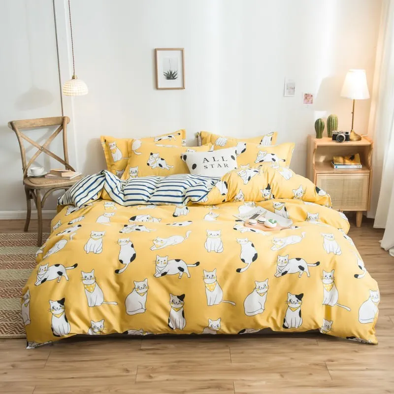 Cotton duvet cover and fitted sheet bedding set in a colour option, shown on a bed