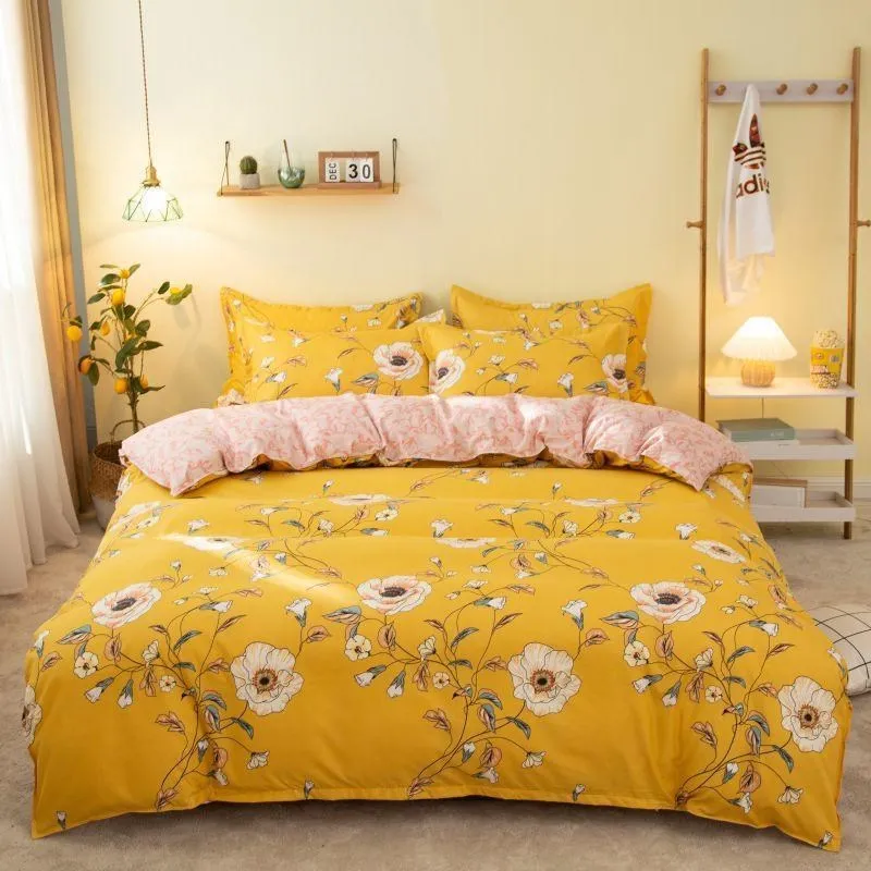 Cotton duvet cover and fitted sheet bedding set in a colour option, shown on a bed